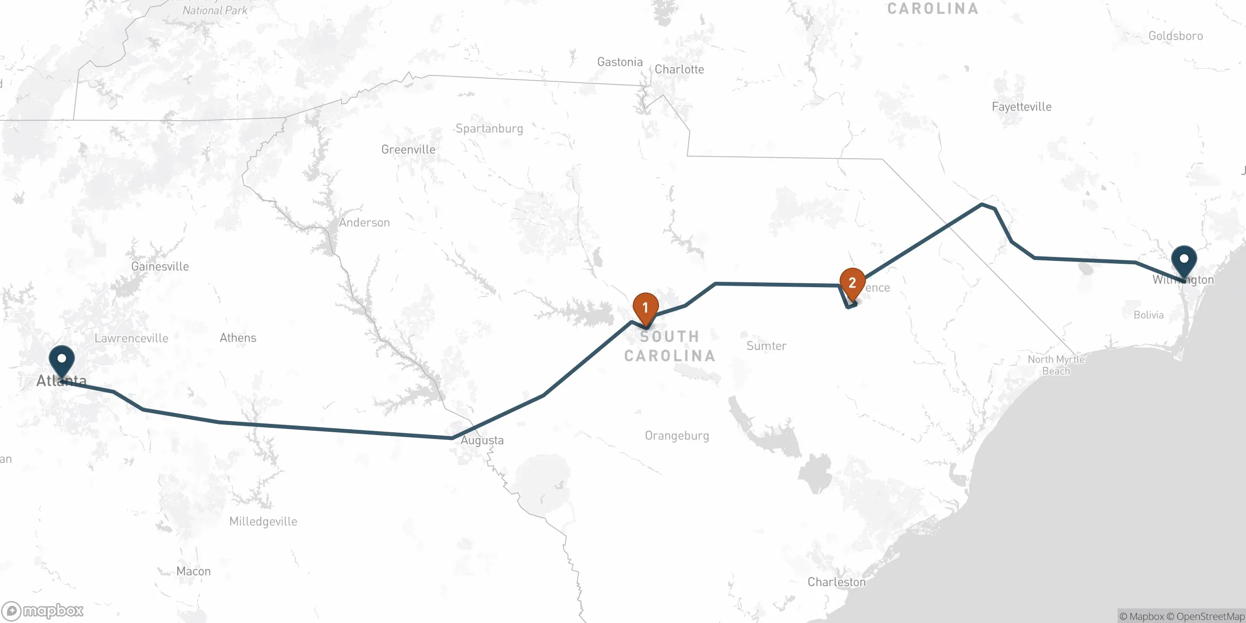 Map of the driving route from Atlanta to Wilmington along I-20, I-95, and US-74, with two suggested stops marked, Columbia and Florence.